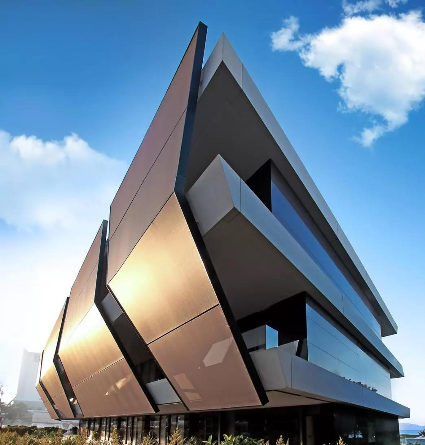 Aluminum composite material (ACM) panels are a popular choice for exterior facade cladding, offering a combination of aluminum and low-density core materials. These lightweight, yet robust panels provide high durability and resistance to weathering, making them ideal for outdoor applications. The aluminum outer layers protect the core from moisture and enhance the panel's fire resistance, while the smooth surface allows for a variety of finishes, including metallic, solid colors, or even custom prints. ACM panels are easy to install and maintain, providing a cost-effective and visually appealing solution for modern architectural facades..jpg Aluminum composite material (ACM) panels are a popular choice for exterior facade cladding, offering a combination of aluminum and low-density core materials. These lightweight, yet robust panels provide high durability and resistance to weathering, making them ideal for outdoor applications. The aluminum outer layers protect the core from moisture and enhance the panel's fire resistance, while the smooth surface allows for a variety of finishes, including metallic, solid colors, or even custom prints. ACM panels are easy to install and maintain, providing a cost-effective and visually appealing solution for modern architectural facades..jpg